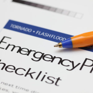 Emergency Checklist and ballpoint pen. Close-up.
